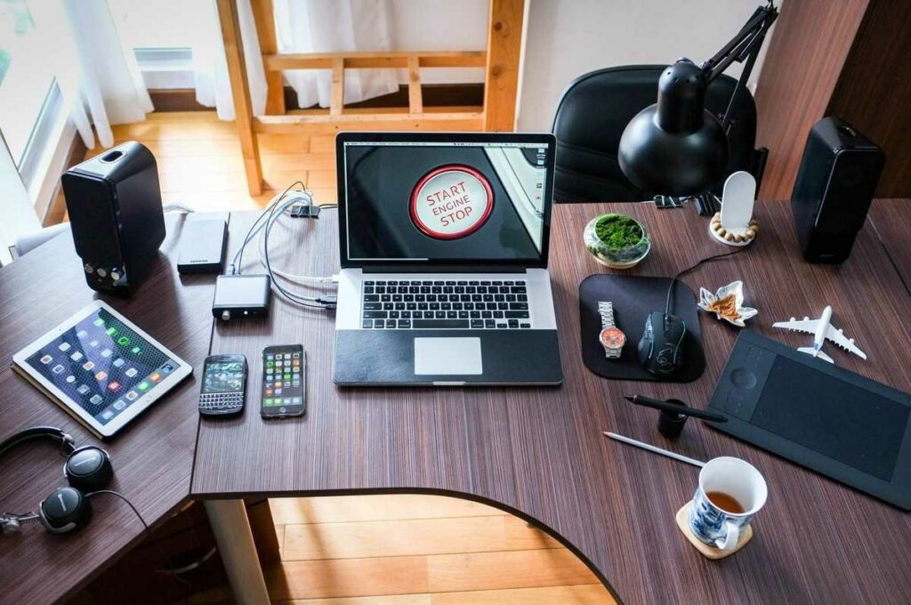 Digital devices on a workspace desk
